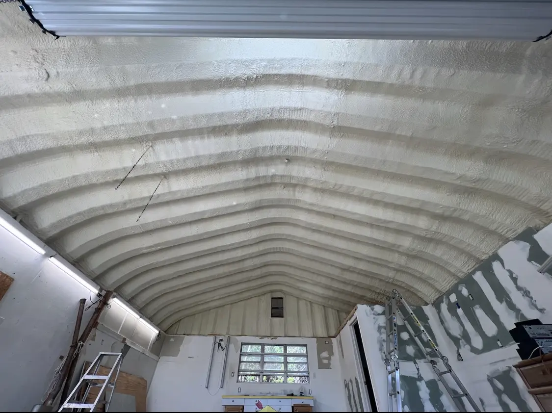 Spray polyurethane foam applied to the underside of a metal roof deck in Minnetrista